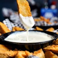 Wedges & Queso · Potato wedges served with a side of queso