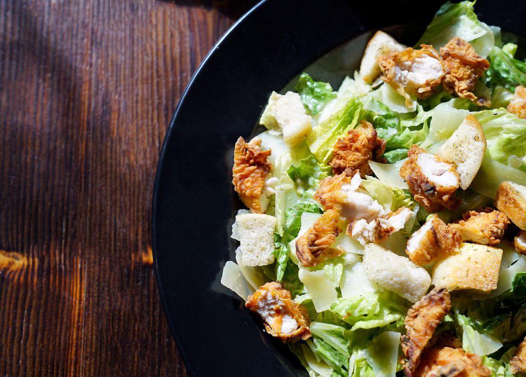Chicken Caesar Salad · Romaine lettuce, Spiedie chicken, shaved Parmesan cheese and croutons with Caesar dressing.