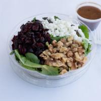 Mesculine Salad · Goat cheese, walnuts, cranberries and over a bed of mixed greens.