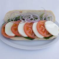 Caprese Sandwich · Thick slices of fresh mozzarella and tomatoes, red onions arugula and light drizzle olive oil.