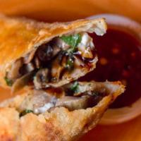 Spring Roll  · Fried and filled with goat cheese, mushrooms and arugula. Served with spicy tomato sauce. Ve...