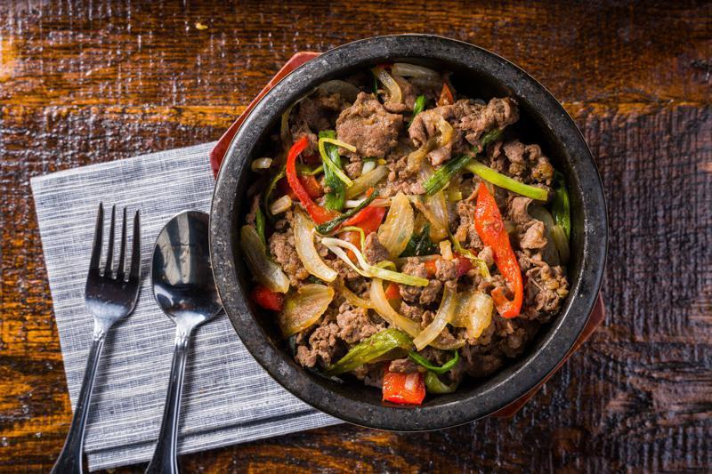 Bulgogi Over Rice · Steamed White Rice topped with Vegetables and thinly sliced
beef Ribe-Eye.