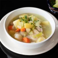 Sopa de pollo · Chicken soup with vegetables and Mexican seasonings.