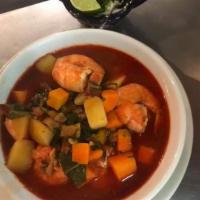 Caldo de Camaron · Mexican shrimp soup flavored with ancho and pasilla chiles and vegetables in a lightly spicy...