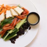 Meatless Miso Stack · Mixed lettuces, matchstick carrots, raisins, English cucumbers, tomatoes, topped with fried ...