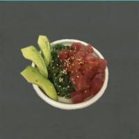 Tuna Poke · (*raw or undercooked) 
Diced up tuna is laid on top of a bed of seaweed salad. There is a si...