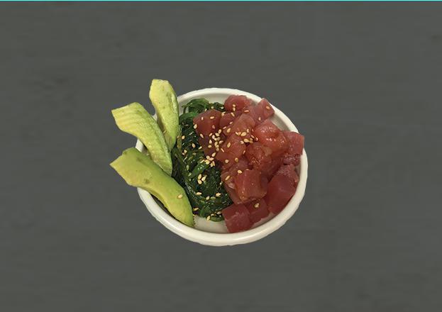 Tuna Poke · Diced up tuna is laid on top of a bed of seaweed salad. There is a side of avocado inside the small poke bowl with sesame seeds.