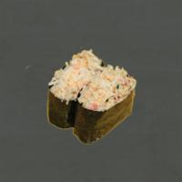 Tobikko Crab Salad · 2 pieces. Crab salad mixed with tobiko laid on top of rice surrounded by nori.