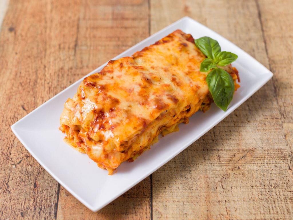 Lasagna · Served with three  garlic rolls.