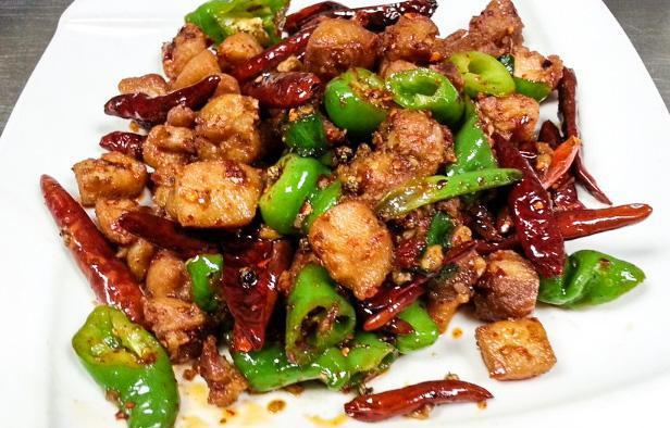 76. Stir-Fried Chicken with Spicy Capsicum · Hot and spicy.