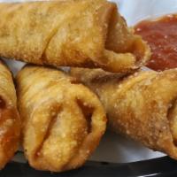 Pizza Logs · Pepperoni and cheese deep fried in flaky dough, served with marinara sauce.