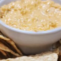 Buffalo Chicken Wing Dip · A creamy dip of shredded, tender chicken mixed with buffalo wing sauce, cream cheese and ble...