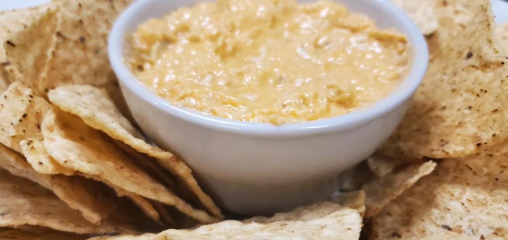 Buffalo Chicken Wing Dip · A creamy dip of shredded, tender chicken mixed with buffalo wing sauce, cream cheese and bleu cheese dressing, served with tortilla chips.