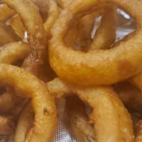 Onion Ring Basket · Thick cut onion rings dipped in a light batter, served golden and crispy with a side of knuc...