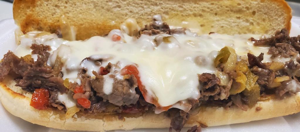 Steak & Cheese Bomber  · Thinly sliced seasoned grilled steak, piled high on a toasted sub roll, topped with sauteed mushrooms, onions, peppers and mozzarella cheese. Served with club fries.