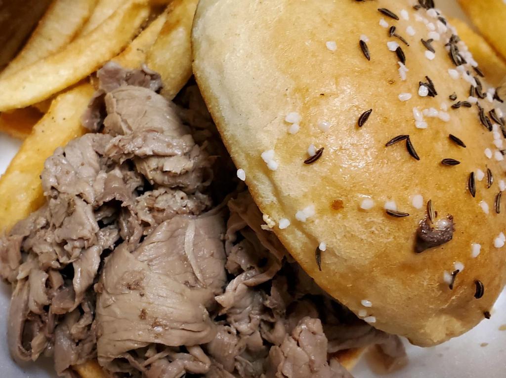 Beef on Kimmelweck Sandwich · Savory sliced roast beef piled on a Kimmelweck roll with a side of horseradish and Au jus for dipping. Served with club fries.