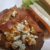 Black and Bleu Burger · 1/2 lb. juicy burger with crumbly bleu cheese, cajun seasoning and bacon. Dressed with lettu...