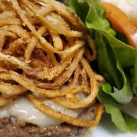 Crackin' KO Burger · 1/2 lb. burger topped with pepper jack cheese, piled high with onion straws and famous meat ...