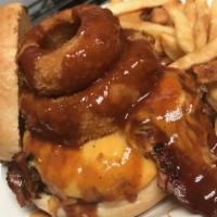 BBQ Hog Burger · 1/2 lb. burger, bacon, bbq pulled pork, cheddar cheese and topped with an onion ring. Dresse...