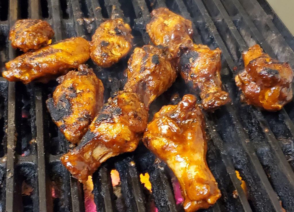 Grilled Jerk Wings (10) · 10 Jumbo Chicken Wings Tossed in Specialty Jerk Wing Sauce, then grilled to finish.