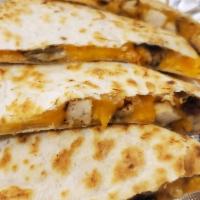 Quesadilla · Grilled flour tortillas filled with melted cheddar cheese, diced tomatoes , jalapenos and ja...