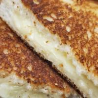 Grilled Cheese Sandwich · White american cheese grilled to perfection. Served with club fries.