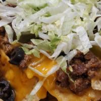 Loaded Nacho Platter · Crispy tortilla chips covered with choice of beef, chicken or pulled pork, nacho cheese, top...