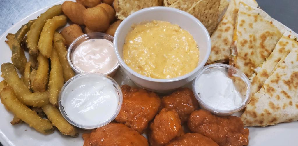 Knockout Platter · Tasty sampling of boneless wings, cheese quesadilla, white cheddar cheese curds, pickle fries and a choice of dip with tortilla chips. Served with sriracha ranch bleu cheese and sour cream.