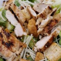 Grilled Chicken Caesar Salad · Grilled chicken breast on a bed of romaine lettuce and crunchy croutons tossed in Caesar dre...