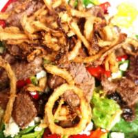 Steak Salad · Romaine lettuce , roasted red peppers, sauteed mushrooms, crumbly blue, onion straws and sir...