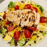 Knuckle Salad · Tossed traditional salad blend, topped with shredded cheddar cheese, grape tomatoes, cucumbe...