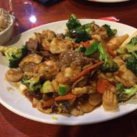 H15. Triple Delight · Chicken, beef, shrimp, broccoli and Chinese vegetables. Served with white rice.
