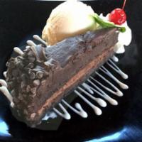 Shokora Bliss · A decadent triple chocolate cake with rich fudge frosting, a sultry mousse layer, and encase...