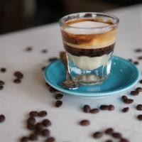 Cortadito Leche & Leche  · Espresso with condensed milk, a hint of milk and foam.