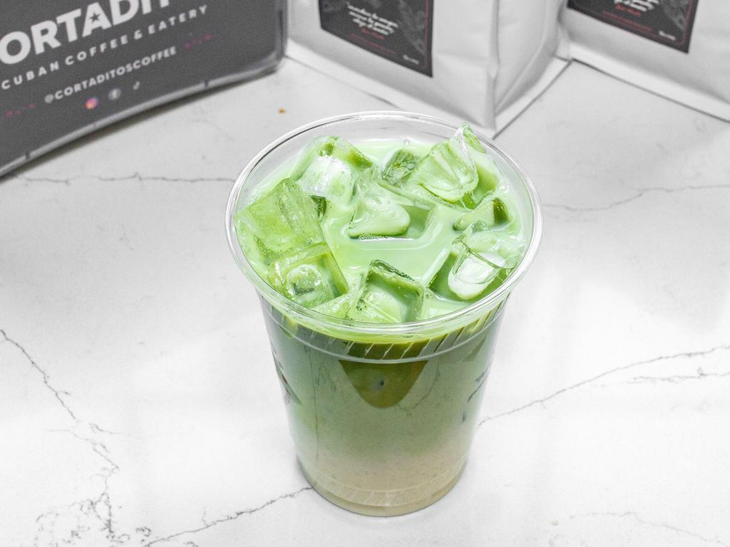 Iced Matcha Latte · Tea-based beverage combining vivid green matcha tea powder and milk to create a smooth, creamy, caffeinated coffee alternative.