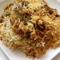 Goat Biryani · Goat and saffron rice in biryani herbs served with raita. One of the most popular items on t...