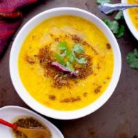 Yellow Dal Tadka · Yellow lentils cooked with fresh tomato, onion, cumin, and cilantro.