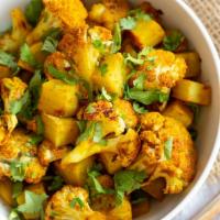 Aloo Gobi · Fresh cauliflower and potatoes sautéed in mild spices with tomatoes, onion, ginger, garlic, ...