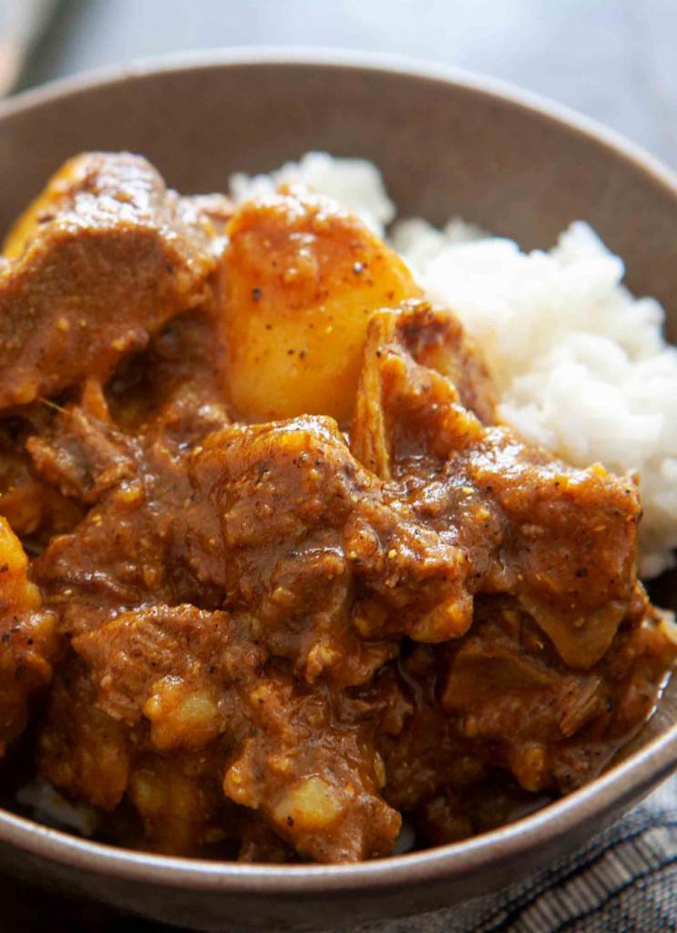 Goat Curry · Spicy goat meat with onions.