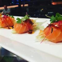 Salmon Cannon · Spicy crabmeat and cucumber wrapped in salmon.