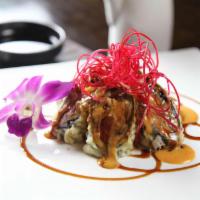 Mini Volcano Roll · Tempura fried roll with white tuna and crab meat inside glazed in spicy mayo and eel sauce.