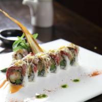 Surf and Turf Maki Roll · Lobster tempura and asparagus rolled inside topped with seared filet mignon glazed in sweet ...