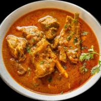 Nala’s Mutton Kolambu (Goat Curry) · Chef’s special goat with bone, cooked with house special spices, savory curry. 