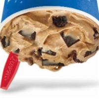Choco Brownie Extreme Blizzard · Chewy brownie pieces, choco chunks and cocoa fudge blended with creamy DQ vanilla soft serve...