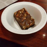 Turtle Brownie · Covered in caramel and drizzled withe chocolate and nuts