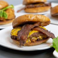 Bacon Smushburger · 2 smushburger patties beef, bacon cheddar and onion patty with 2 strips of thick cut bacon a...