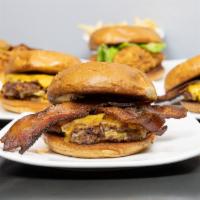 Bacon Cheddar Smushburger · 2 smushburger patties beef, bacon cheddar and onion patty with 2 strips of thick cut bacon a...