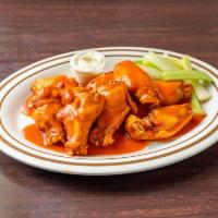 10 Authentic Buffalo Wings · Served with celery and blue cheese and choice of sauces.