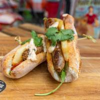 Lamb Sausage Sandwich ·  Organic 100% lamb sausage, sauted peppers onions, cilantro, fries, arugula, harissa mayo sa...