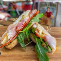 Paris Ham Sandwich  · Ham, tomatoes, arugula, melted brie cheese, mayo and organic baguette bread.